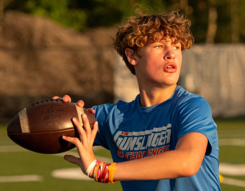 Clinton's Zach McKenzie throws during a drill at the M2 QB Academy.