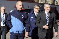 Bolton Wanderers' chairman Phil Gartside (R) arrives with club doctor Jonathan Tobin (L) to visit the London Chest Hospital on March 19, 2012 where Bolton player Fabrice Muamba is being treated after suffering a cardiac arrest during a match on March 17. Muamba was in a stable but critical condition on March 19, two days after he suddenly collapsed during a match, the hospital treating him said. AFP PHOTO