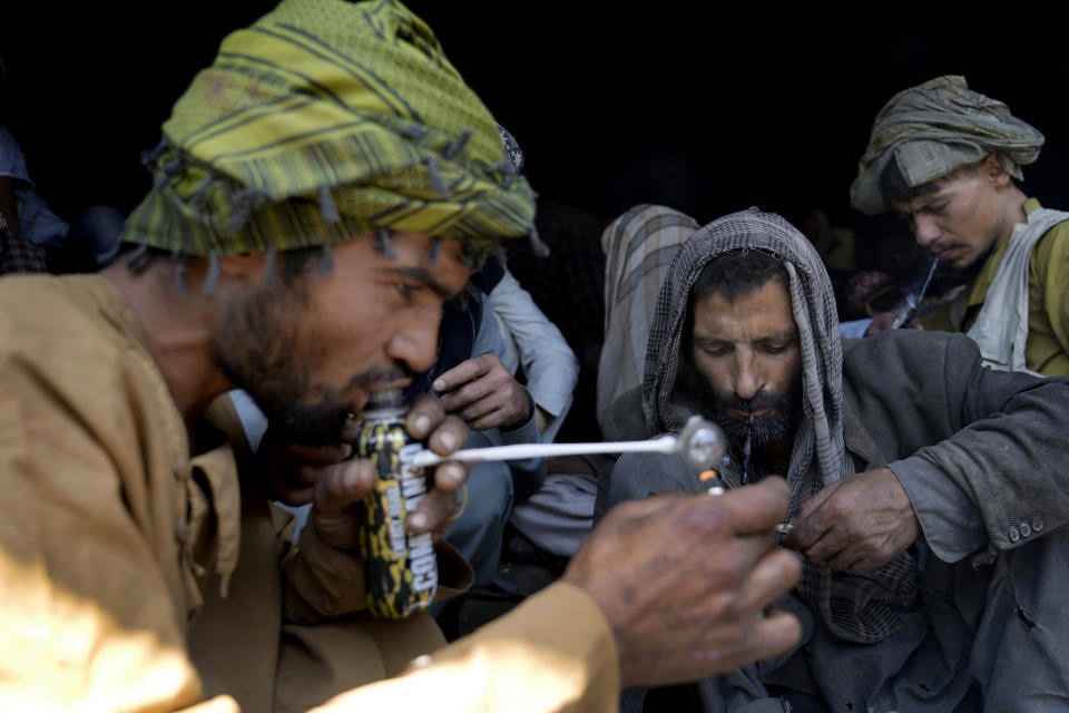 Afghan addicts smoke heroin under a bridge in the city of Kabul, Afghanistan,Thursday, June 9, 2022. Drug addiction has long been a problem in Afghanistan, the world’s biggest producer of opium and heroin. The ranks of the addicted have been fueled by persistent poverty and by decades of war that left few families unscarred. (AP Photo/Ebrahim Noroozi)