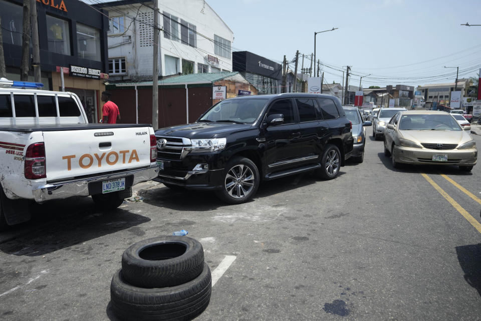 Cars queue to buy fuel at a petrol station in Lagos, Nigeria Tuesday, April 30, 2024. Nigerians were queuing for hours to buy fuel across major cities on Tuesday as the West African nation faced its latest fuel shortage, resulting in increased hardship for millions already struggling with the country's economic crisis. (AP Photo/Sunday Alamba)