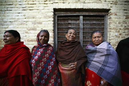 Nepalese women stand in a queue outside a polling station to cast their votes during the Constituent Assembly Election in Bhaktapur November 19, 2013. REUTERS/Navesh Chitrakar