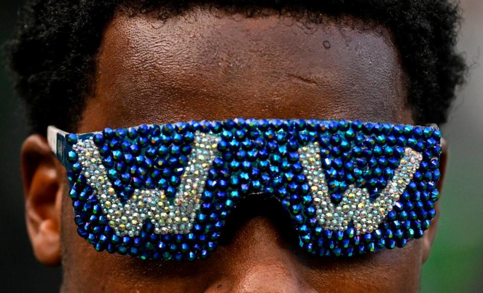 Seattle Seahawks cornerback Devon Witherspoon (21) wears “W” glasses after the Seahawks’ 20-10 victory against the Arizona Cardinals at Lumen Field, Sunday, Oct. 22, 2023, in Seattle, Wash.