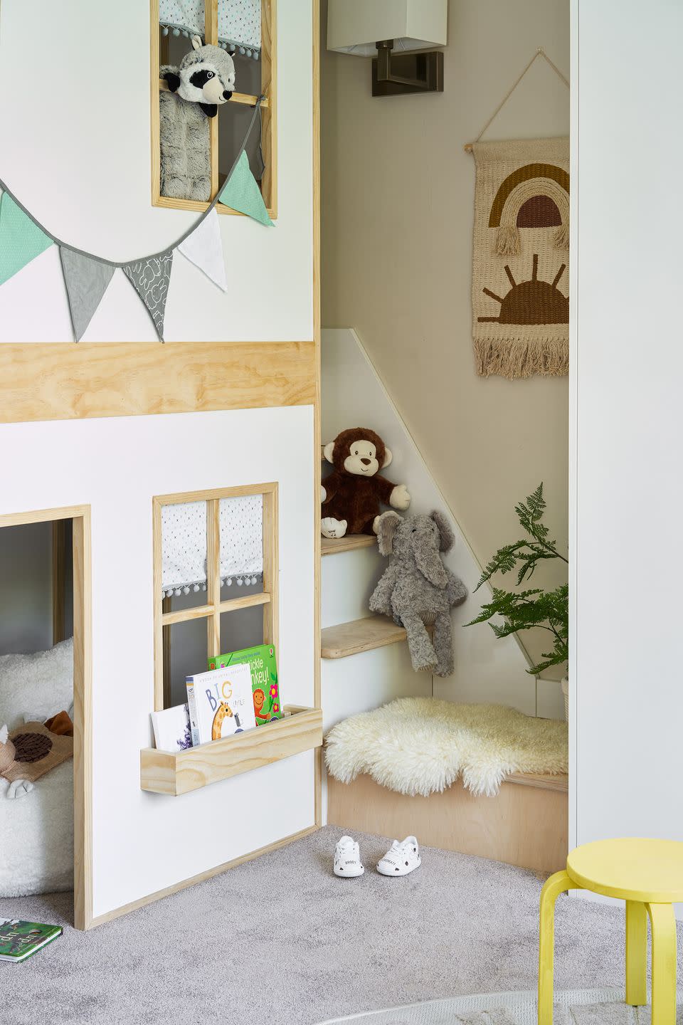 <p>A playroom staple, and a lovely opportunity to give children some space all of their own. Playhouses certainly don't have to be standard plastic creations – this is a DIY version that takes advantage of a spare corner. </p><p>Pictured: Wall hanging and other accessories, <a href="https://www.wayfair.co.uk/children-nursery/cat/children-nursery-c476620.html" rel="nofollow noopener" target="_blank" data-ylk="slk:all at Wayfair;elm:context_link;itc:0;sec:content-canvas" class="link ">all at Wayfair</a></p>