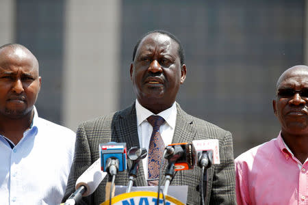 Kenyan opposition leader Raila Odinga (C), the presidential candidate of the National Super Alliance (NASA) coalition speaks during a press conference in Nairobi, Kenya September 26, 2017. REUTERS/Baz Ratner/Files