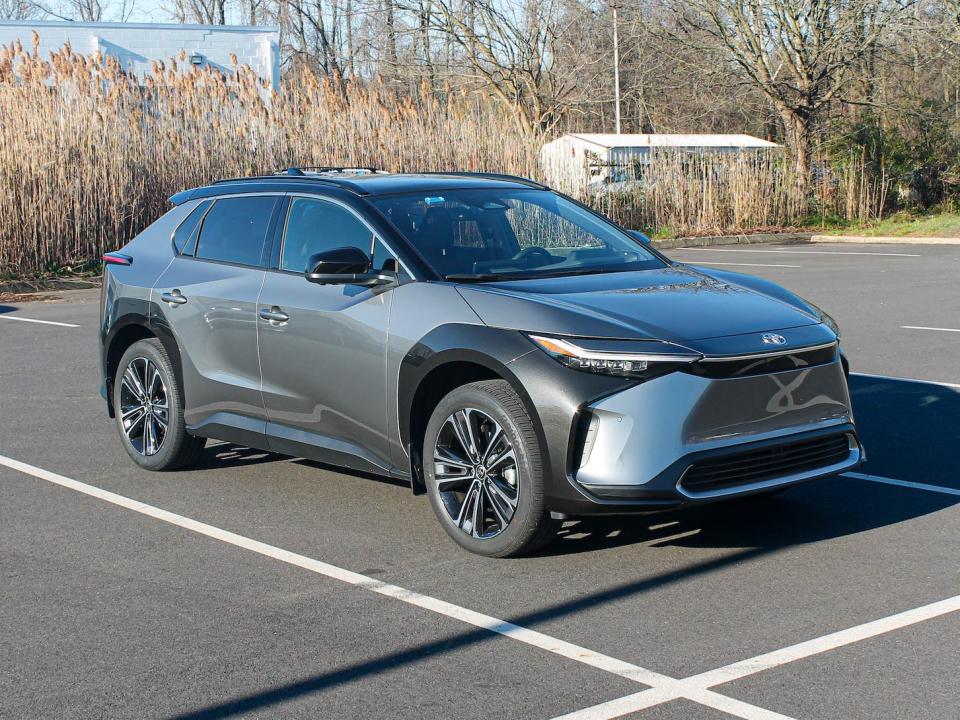 A silver 2023 Toyota bZ4X AWD Limited in a parking lot.