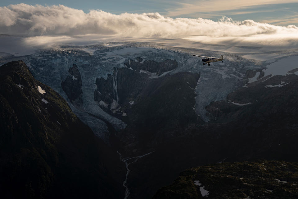 Aviator and adventurer Garrett Fisher flies his plane above the Folgefonna glacier in Norway, on Aug. 10, 2022. Fisher is on a mission to photograph all the remaining glaciers that are not in the polar regions before they disappear. (AP Photo/Bram Janssen)
