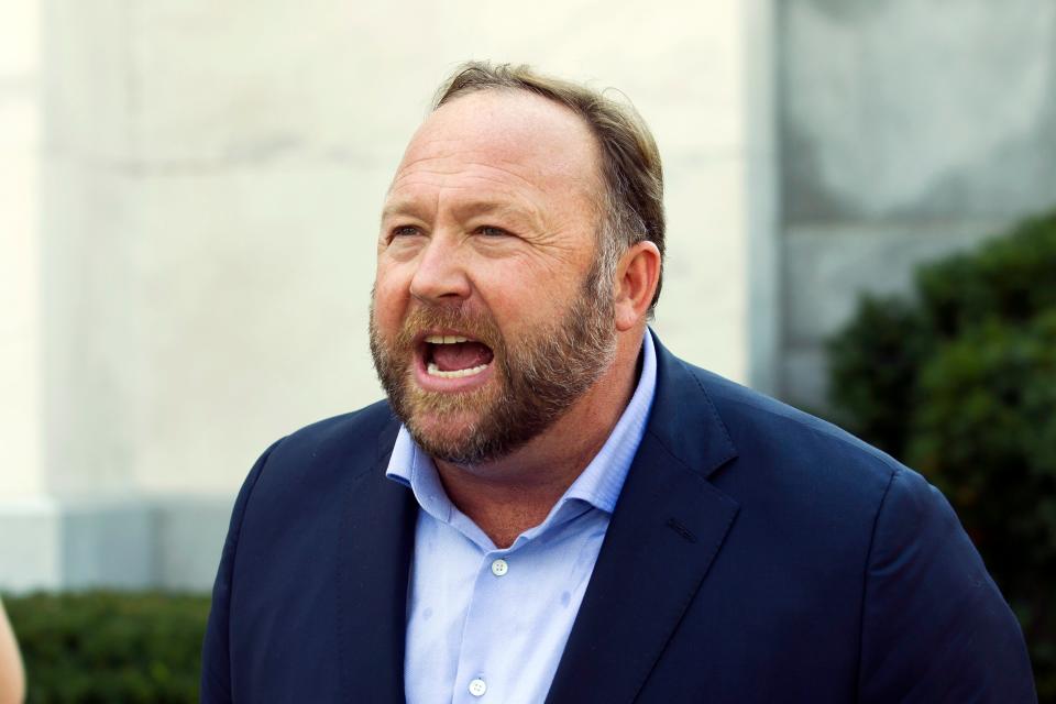 FILE - Infowars host and conspiracy theorist Alex Jones speaks outside of the Dirksen building on Capitol Hill, in Washington, Sept. 5, 2018. Jones will be getting back the $75,000 in fines he paid to a Connecticut court for failing to appear at a deposition last month in a lawsuit over his assertions that the Sandy Hook Elementary School shooting was a hoax, a judge has ruled, Thursday, April 14, 2022.