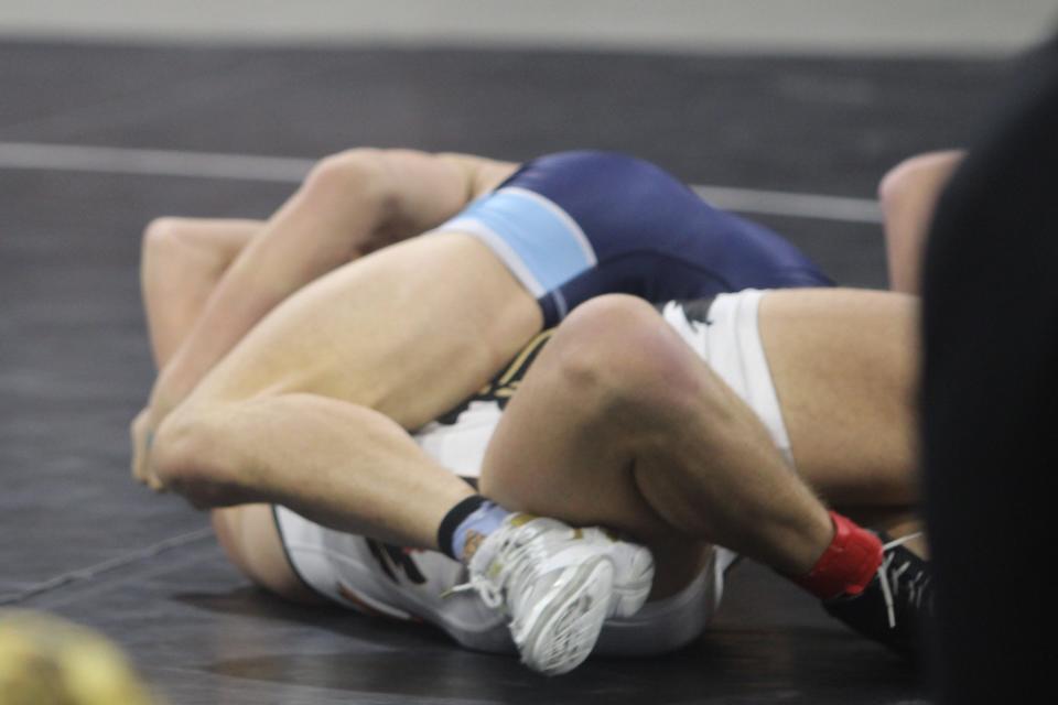 Chase Youse of Kalispell Flathead is about to be pinned by Brendan Lockart of Great Falls High in the Class AA 205-pound championship bout of the All-Class State Wrestling Tournament Saturday evening at MetraPark in Billings.