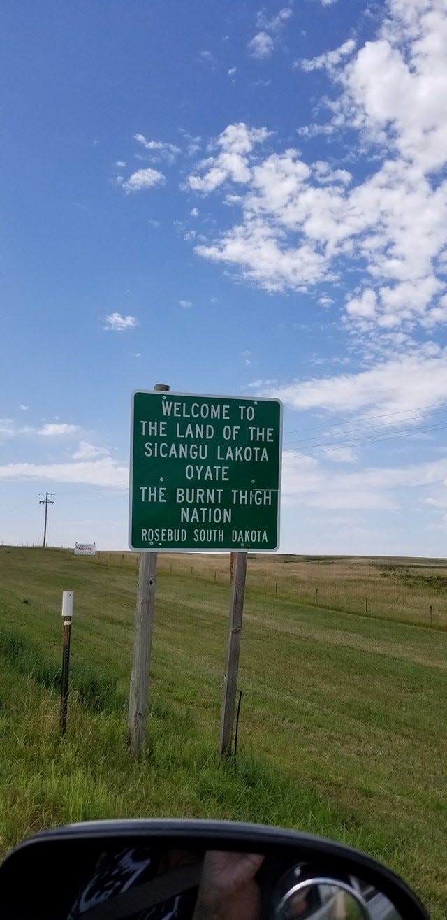 Sandy White Hawk will never forget the day she saw this sign, in 1988. For the first time in more than three decades, the Sicangu Lakota adoptee was home.