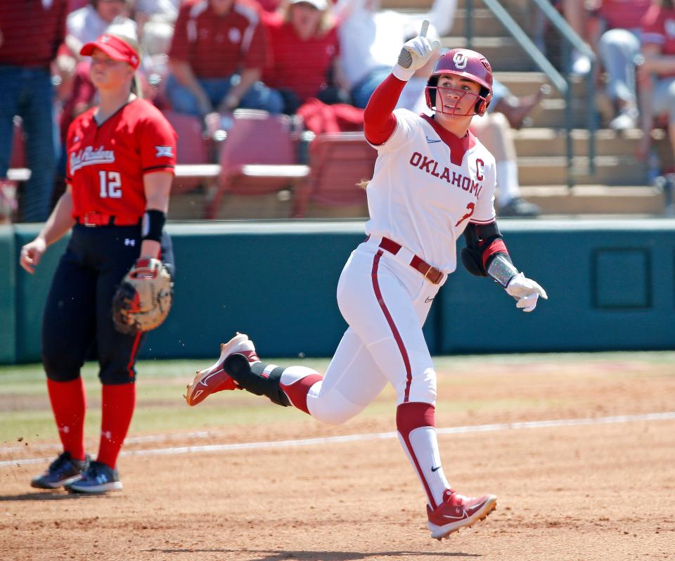 OU's Grace Lyons (3) celebrates a home run next to Texas Tech's Ellie Bailey (12) in the second inning of a 7-0 win Saturday at Marita Hynes Field in Norman.
