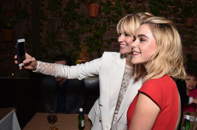 January Jones and Kiernan Shipka take a selfie at the AMC Holiday Party on Nov. 13, 2014, in West Hollywood, California.