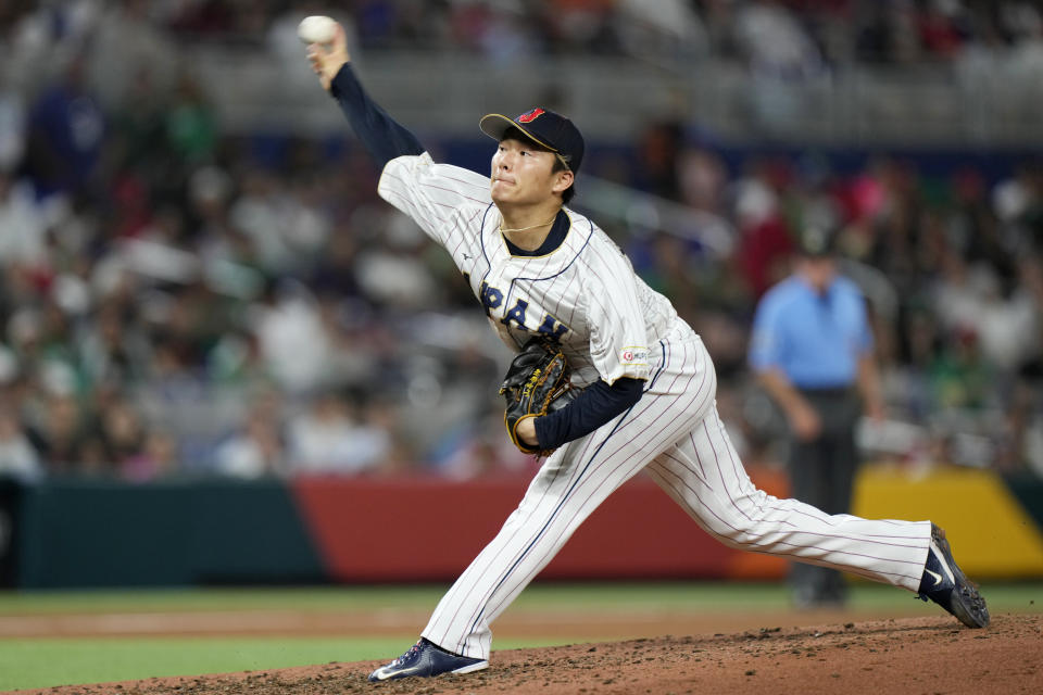 Japan's Yoshinobu Yamamoto delivers a pitch during the fifth inning of a World Baseball Classic game against Mexico, Monday, March 20, 2023, in Miami. (AP Photo/Wilfredo Lee)
