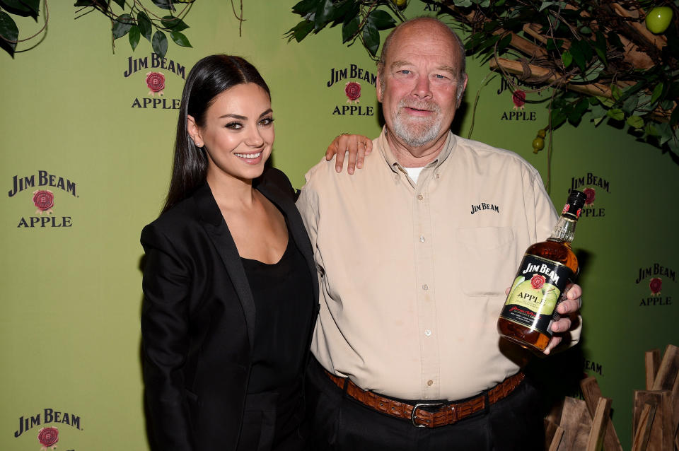 Mila Kunis pictured with Fred Noe, seventh generation Jim Beam Master Distiller, at a Jim Beam Apple launch event on Oct. 20, 2015 in New York City. (Photo: Bryan Bedder via Getty Images)