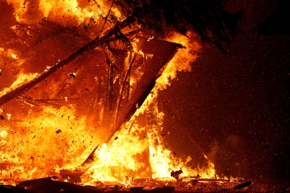 A burning structure collapses during the Kincade fire in Geyserville, California, U.S. October 24, 2019. REUTERS/Stephen Lam     TPX IMAGES OF THE DAY