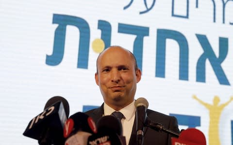 Education Minister Naftali Bennett demanded to be given the defence portfolio, threatening to withdraw his eight seats from Mr Netanyahu's governing coalition - Credit: MENAHEM KAHANA/AFP/Getty Images