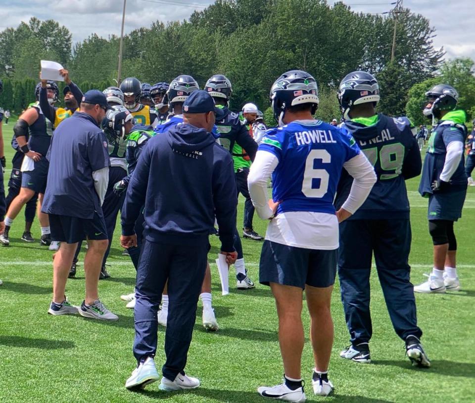 Quarterback Sam Howell (6) participating with starter Geno Smith (not pictured) in Seahawks offensive line drills under coach Scott Huff at the fifth of 10 organized team activities (OTAs) practices at team headquarters May 30, 2024, in Renton.