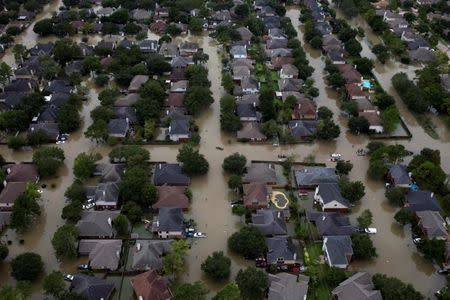 FILE PHOTO: Houses are seen submerged in flood waters caused by Tropical Storm Harvey in Northwest Houston, Texas, U.S. on August 30, 2017. REUTERS/Adrees Latif/File Photo