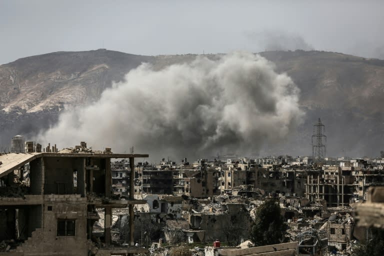 Smoke billows following a reported air strike in the rebel-held parts of Jobar district, on the eastern outskirts of the Syrian capital Damascus, on March 19, 2017