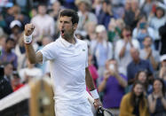 Serbia's Novak Djokovic celebrates after beating United States' Denis Kudla in a Men's singles match during day three of the Wimbledon Tennis Championships in London, Wednesday, July 3, 2019. (AP Photo/Tim Ireland)