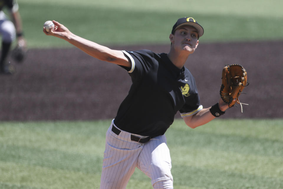 Oregon pitcher Jackson Pace throws against Oral Roberts during the first inning of an NCAA college baseball tournament super regional game Sunday, June 11, 2023, in Eugene, Ore. (AP Photo/Amanda Loman)