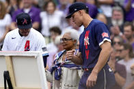 National League's Freddie Freeman, of the Atlanta Braves, left, and American League's Aaron Judge, of the New York Yankees, right, escort the wife of the late Hank Aaron, Billye Aaron to the field prior to the MLB All-Star baseball game, Tuesday, July 13, 2021, in Denver. (AP Photo/Jack Dempsey)