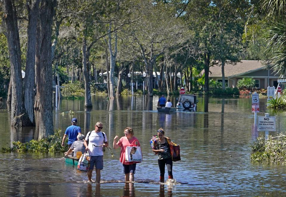 High water rescues of people and pets at Colony In the Wood mobile home park in Port Orange from high water from tropical storm Ian, Saturday, Oct. 1, 2022.