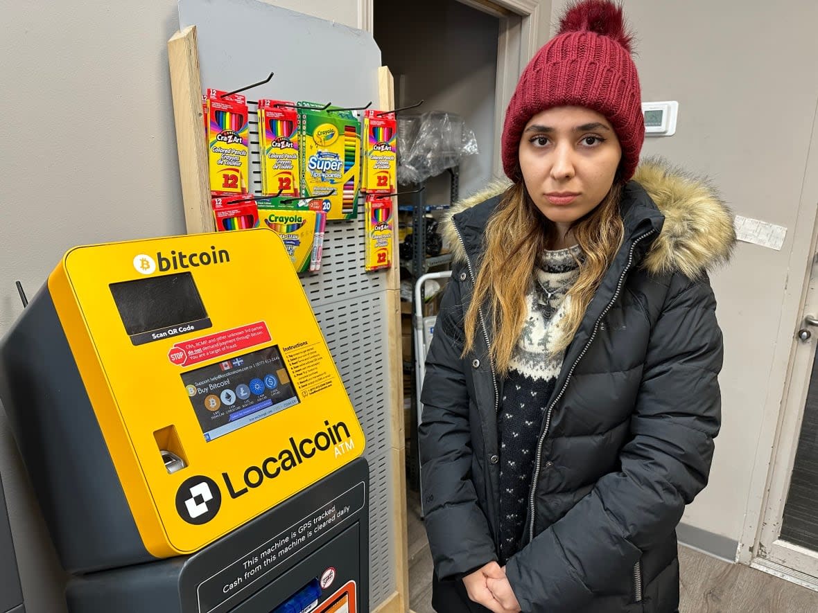 Parisa Ghanbari said a phone scammer pretending to be a federal government agent convinced her to deposit nearly $11,000 in a downtown Edmonton bitcoin ATM. (Scott Neufeld/CBC - image credit)