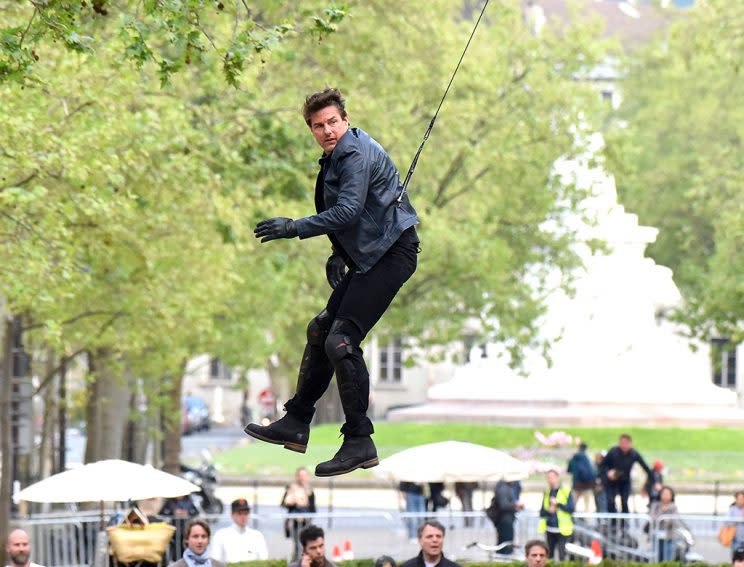 The <i>Top Gun</i> alum flew through the air — otherwise known as the danger zone — on the Paris set of his latest <i>Mission: Impossible</i> movie. (Photo: Splash News)