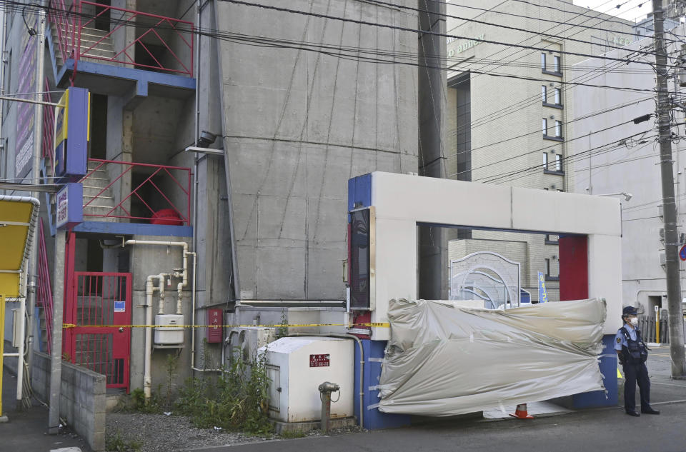 This shows a hotel where the headless body of a man was found in Sapporo, northern Japan on July 8, 2023. Japanese police said Tuesday, July 25 they have arrested a woman and her parents in a bizarre beheading case in a popular night entertainment district in Japan's northern city of Sapporo, where the headless man was found in a hotel room three weeks ago. (Kyodo News via AP)