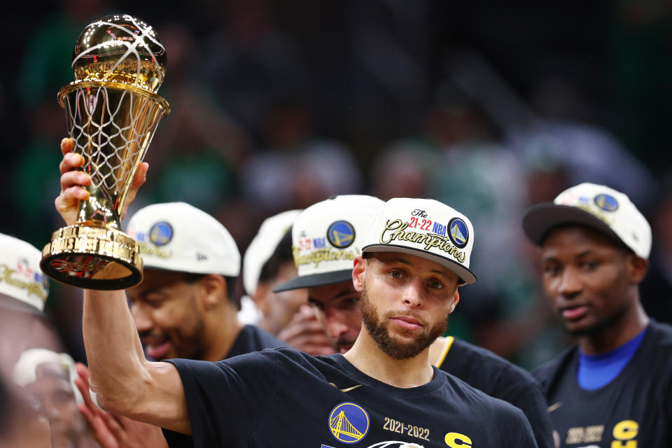 BOSTON, MASSACHUSETTS - JUNE 16: Stephen Curry #30 of the Golden State Warriors celebrates with the Bill Russell NBA Finals Most Valuable Player Award after defeating the Boston Celtics 103-90 in Game Six of the 2022 NBA Finals at TD Garden on June 16, 2022 in Boston, Massachusetts. NOTE TO USER: User expressly acknowledges and agrees that, by downloading and/or using this photograph, User is consenting to the terms and conditions of the Getty Images License Agreement. (Photo by Elsa/Getty Images)