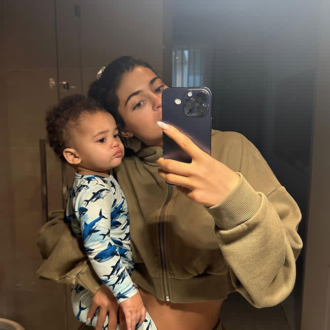 Kylie Jenner takes a mirror selfie with her son Aire in arm