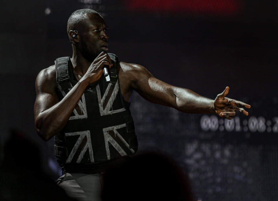 Stormzy, wearing a stab vest designed by the artist Banksy, performs on the Pyramid Stage at the 2019 Glastonbury Festival held at Worthy Farm, in Pilton, Somerset on June 28, 2019 near Glastonbury, England. The festival, founded in 1970, has grown into one of the largest outdoor green field festivals in the world. (Photo by Matt Cardy/Getty Images)