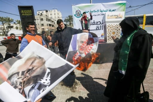 Palestinians burn images of US President Donald Trump and Israeli Prime Minister Benjamin Netanyahu in Gaza the day after Israel's election