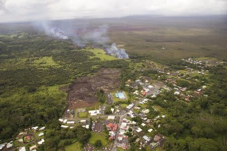 The lava flow from the Kilauea Volcano is seen nearing residential areas in a U.S. Geological Survey (USGS) image taken near the village of Pahoa, Hawaii, October 27, 2014. REUTERS/U.S. Geological Survey/Handout