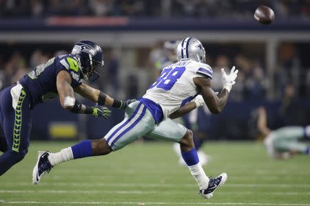 Dec 24, 2017; Arlington, TX, USA; Dallas Cowboys wide receiver Dez Bryant (88) catches a pass against Seattle Seahawks safety Earl Thomas (29) in the third quarter at AT&T Stadium. Mandatory Credit: Tim Heitman-USA TODAY Sports