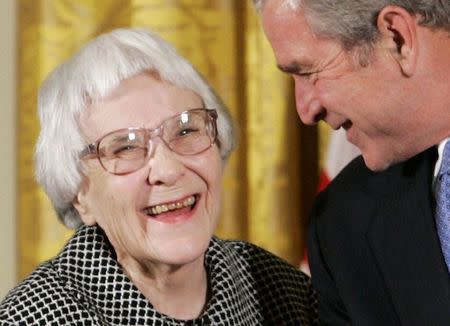 American novelist Harper Lee (L) is awarded the Presidential Medal of Freedom by U.S. President George W. Bush in the East Room of the White House in Washington in this file photo taken November 5, 2007. REUTERS/Larry Downing/Files