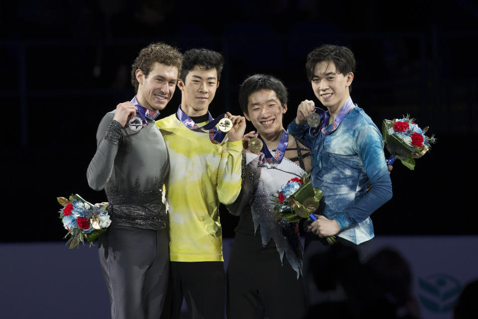 The championship men's skating competition closed with Nathan Chen, second from left, winning his fourth U.S. title with Jason Brown, left, taking silver, Tomoki Hiwatashi finished third and Vincent Zhou, right, taking fourth place at the U.S. Figure Skating Championships, Sunday, Jan. 26, 2020, in Greensboro, N.C. (AP Photo/Lynn Hey)