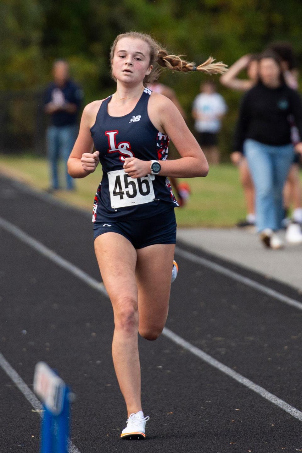 Lincoln-Sudbury senior Charlotte Huck finishes first during the girls cross country meet in Sudbury against Concord-Carlisle and Boston Latin, Oct. 11, 2023.