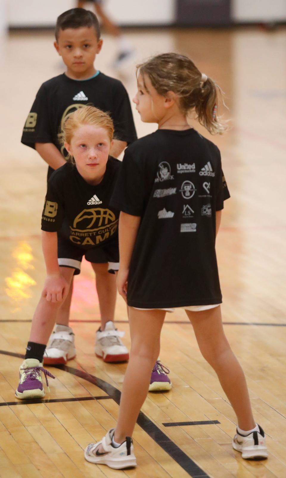 Ten-year-old Bryce Anderson and 7-year-old Sawyer Cepeda go through drills at the Jarrett Culver Basketball Camp at the Apex Event Center on Tuesday, July 19, 2022. (Mark Rogers/For A-J Media)