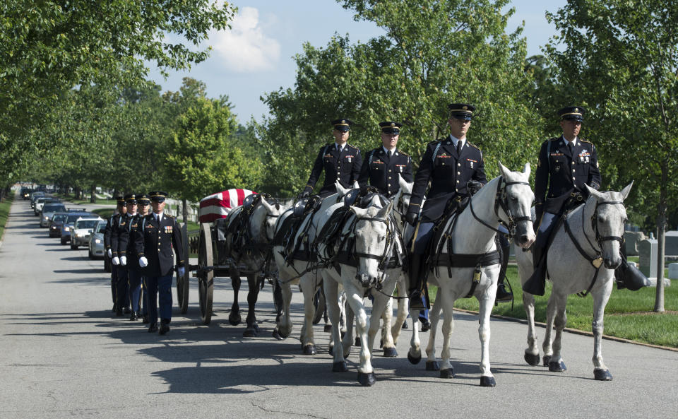 FILE - A U.S. Army Caisson team carries the casket of Army Capt. Stephanie Rader, during a full military honors conducted by the Army's 3rd U.S. Infantry Regiment through Arlington National Cemetery in Arlington, Va., June 1, 2016. Rader, who was an American spy in post-World War II Poland was posthumously awarded the Legion of Merit Wednesday, 70 years after her nomination. The Army has announced changes to the way it will care for the gray and black horses that carry service members' flag-draped coffins to their final resting places in Arlington National Cemetery. (AP Photo/Molly Riley, File)