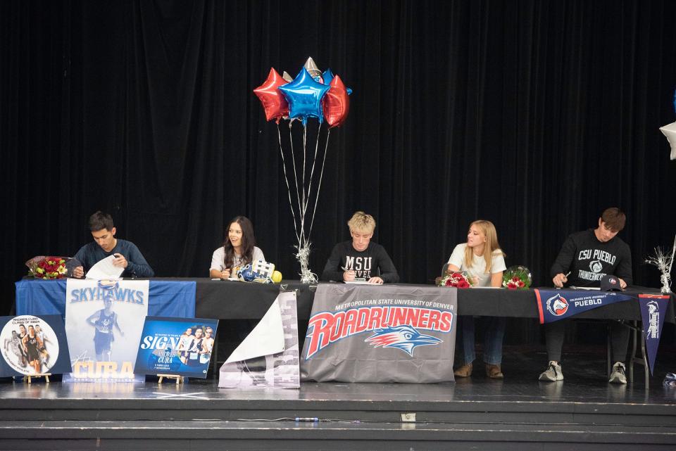 Pueblo South High School seniors, from left, Andres Cura, Danika Bernal, Braden Medina, Jaime Pearson and Ryan Lane sign their letters of intent to continue their athletic careers at their respective colleges and universities on Thursday, November 16, 2023.