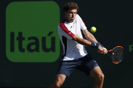 Mar 29, 2018; Key Biscayne, FL, USA; Pablo Carreno Busta of Spain hits a backhand against Kevin Anderson of South Africa (not pictured) on day ten of the Miami Open at Tennis Center at Crandon Park. Mandatory Credit: Geoff Burke-USA TODAY Sports