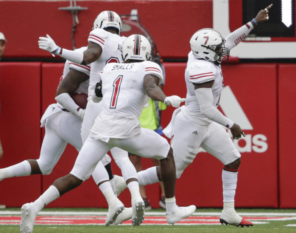 Jawuan Johnson (R) celebrates after scoring a touchdown on an interception of a throw by Nebraska quarterback Tanner Lee. (AP Photo/Nati Harnik)