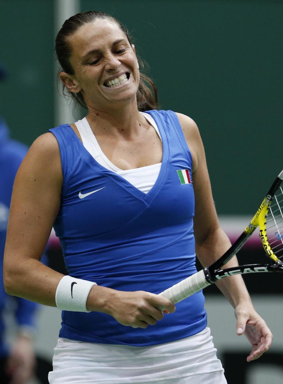 Italy's Roberta Vinci reacts after loosing a point to Czech Republic's Petra Kvitova during their Fed Cup semifinal tennis match in Ostrava, Czech Republic, Sunday, April 20, 2014. (AP Photo/Petr David Josek)