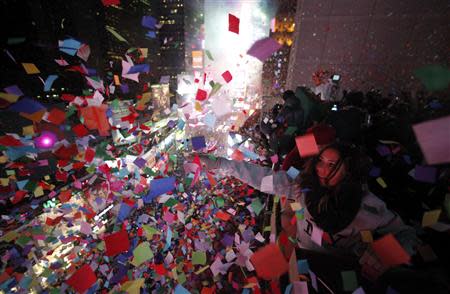 Confetti is dropped on revelers at midnight during New Year's Eve celebrations in Times Square in New York