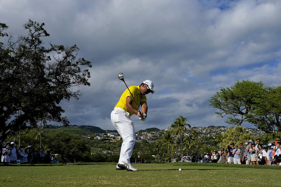 Hideki Matsuyama, of Japan, plays his shot from the 14th tee during the final round of the Sony Open golf tournament, Sunday, Jan. 16, 2022, at Waialae Country Club in Honolulu. (AP Photo/Matt York)