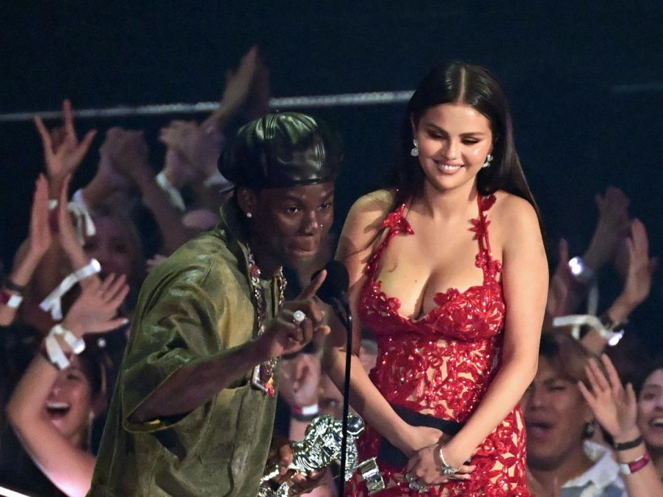 Rema and Selena Gomez accept the Best Afrobeats award for ‘Calm Down’ at the MTV Video Music Awards, 12 September 2023 (AFP via Getty Images)