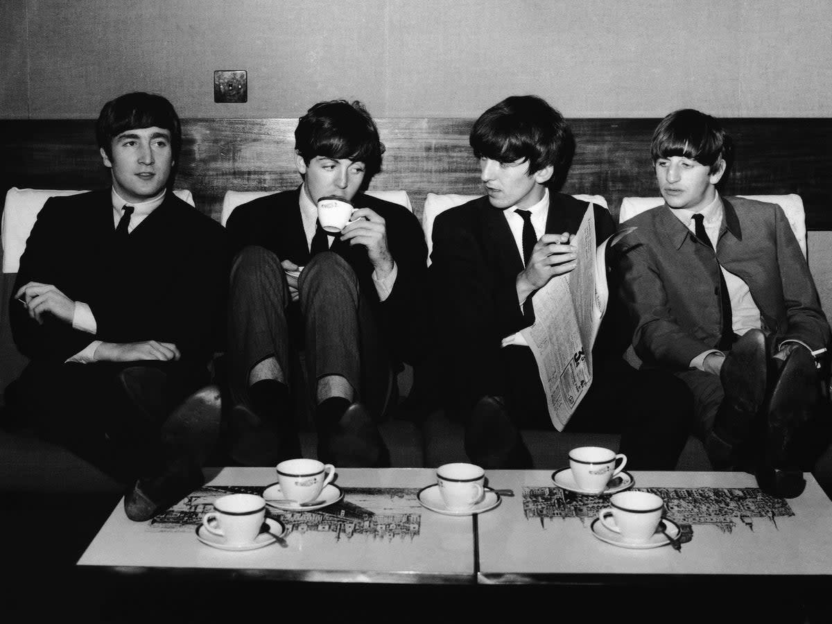 The Beatles take a break from their rehearsals for the 1963  Royal Variety Performance with a coffee after lunch at the Mapleton Hotel. From left: John Lennon, Paul McCartney, George Harrison and Ringo Starr (Getty)