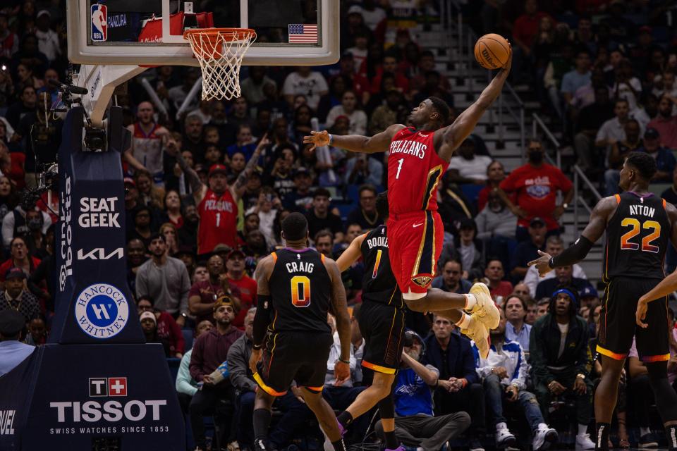 Pelicans forward Zion Williamson takes off for a dunk against the Suns in a Dec. 9 game in New Orleans.