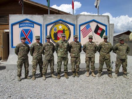 U.S. commander General for Afghanistan, John Nicholson (4th L) poses for picture at forward operating base Gamberi, Laghman province, April 4, 2016. REUTERS/Paul Tait